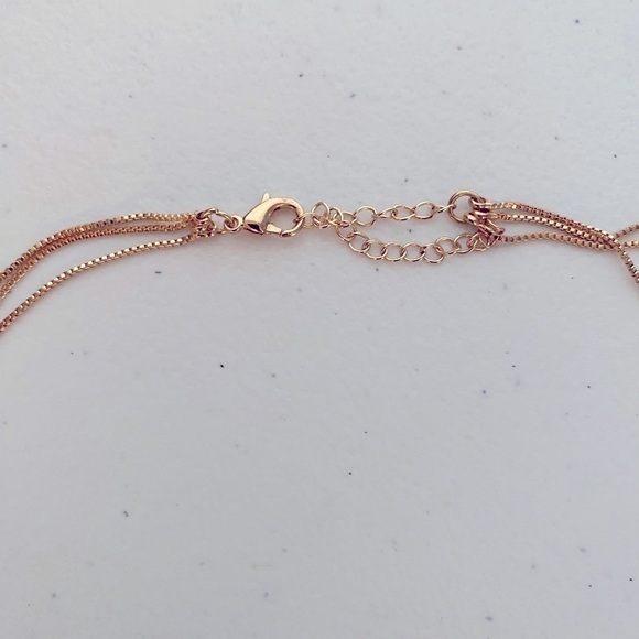 GOLDEN 3 LAYERED STAGGERED CHAIN NECKLACE WITH CLEAR JEWELED HEARTS - Picture 3 of 3